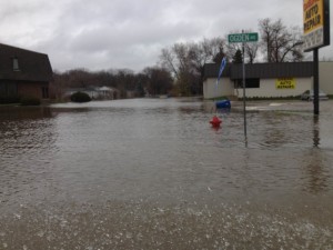 Businesses and homes lining Ogden Avenue in Lisle are submerged up to three feet in storm water.