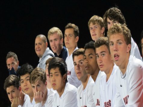 Members of the soccer team looking on anxiously during their state title run