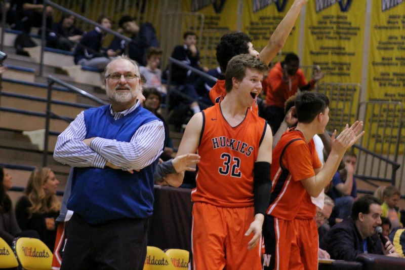 Head+Coach+Jeff+Powers+and+the+Naperville+North+boys+basketball+team+get+fired+up+during+their+66-38+win+over+Neuqua+Valley