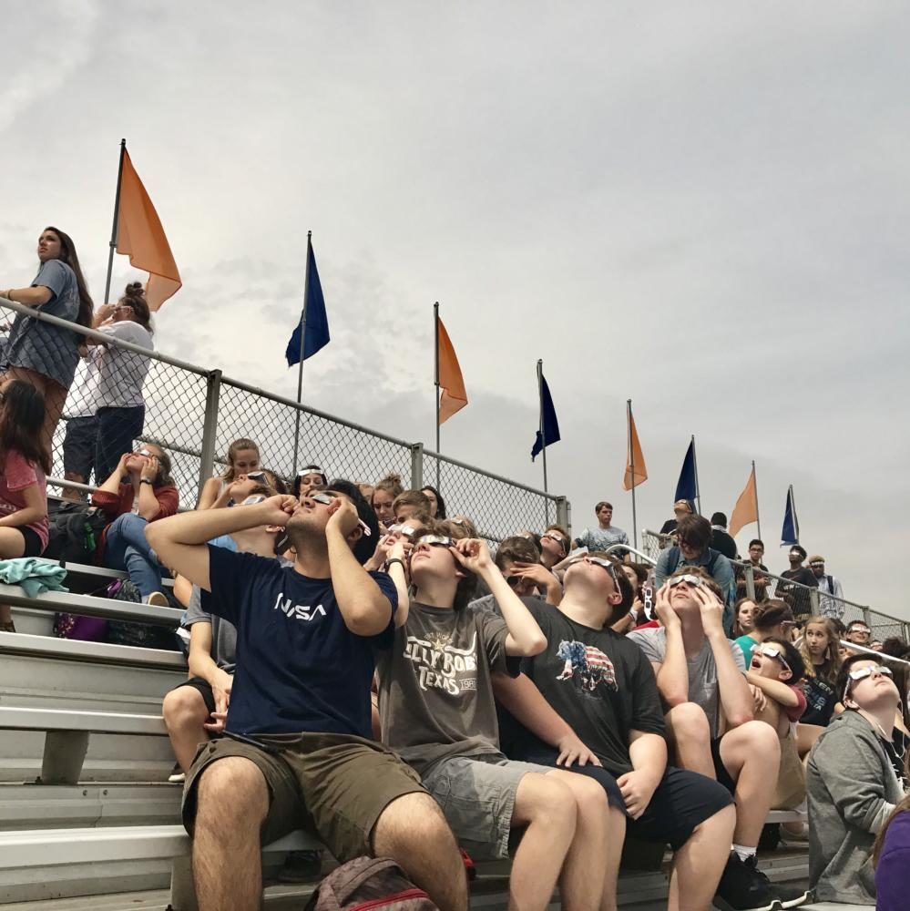 NNHS students and staff gather under Mondays solar eclipse