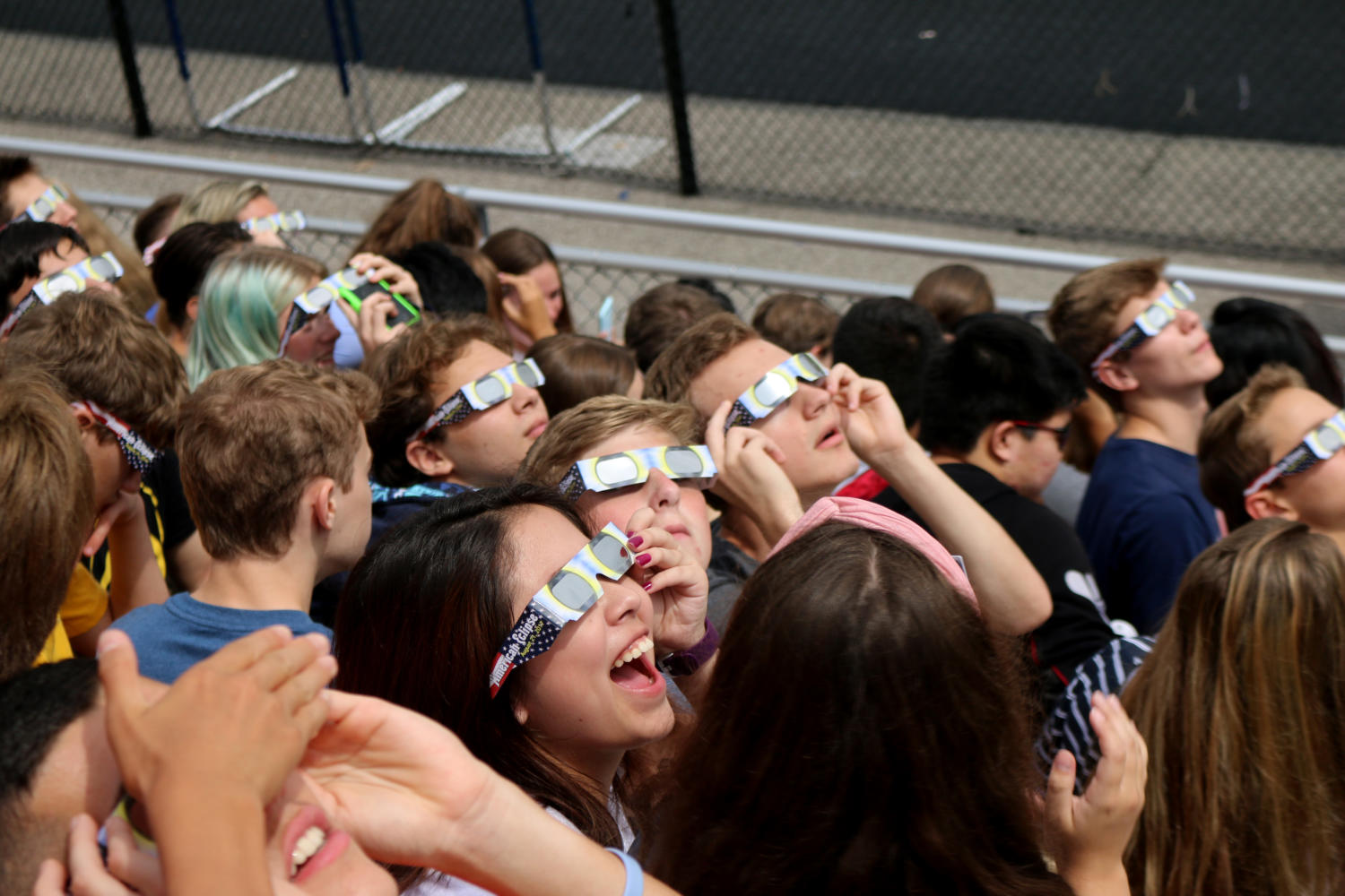 During the assembly, students look at the solar eclipse at the peak of its visibility from the football field. Many Naperville North High School students like senior Ben Benaitis had their expectations exceeded. “The fact that we were in school unexpectedly made the experience a lot better. I got to be with my friends the whole time and I definitely wouldnt have gone out and gotten the glasses on my own,” Benaitis said.

