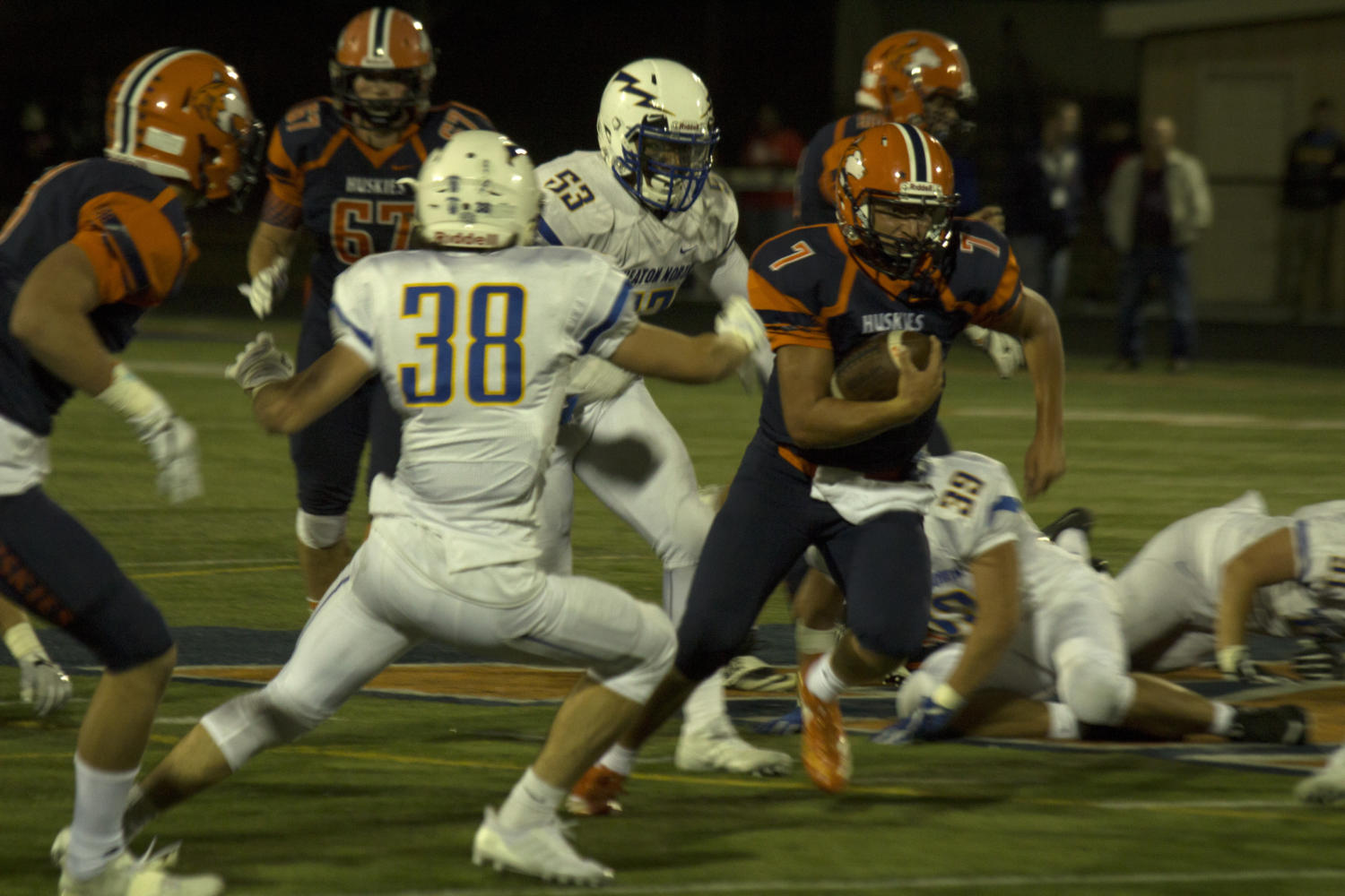 Huskie football improves to 3-0 with offensive explosion on Senior Night