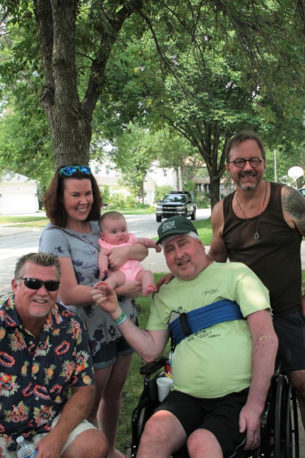 Mazzarella poses with NNHS teacher Tim Johnson, Naperville Central teacher Crystal Griffith with her daughter Waverly and Kermit Eby. 

Photographed by Lily Mccormick