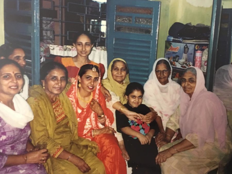 After my mom’s marriage to my dad, her family poses for a picture in their one-bedroom apartment in Kolkata, India.