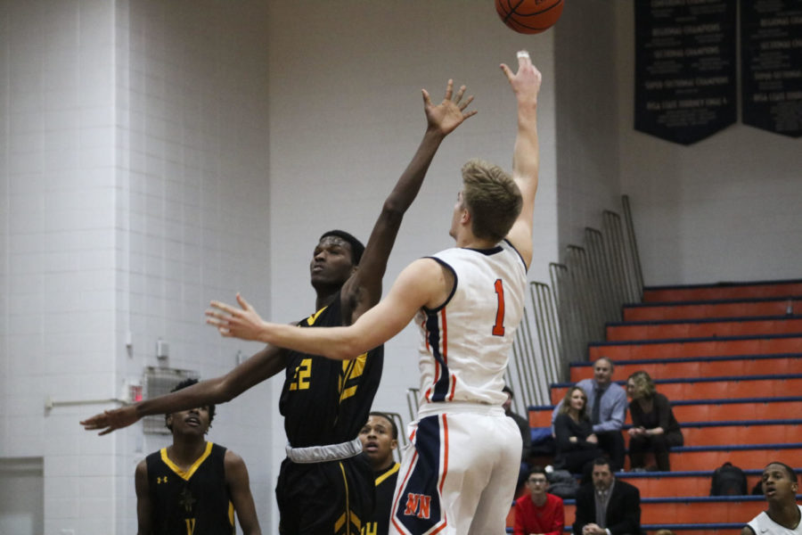 Huskie boys basketball wins big over Rich East with charity night