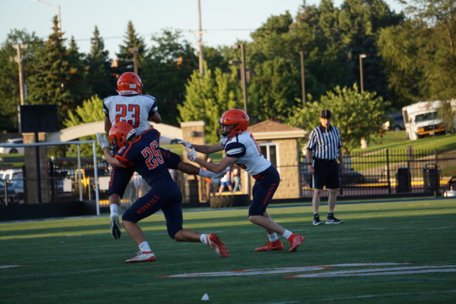 Junior Callum Galpin tackles junior Jeovany Garduno Lopez during the Blue and Orange Scrimmage.