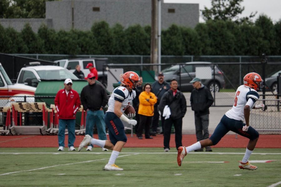 Matt Maschmeier (1) returns the kick-off after a Redhawk touchdown.