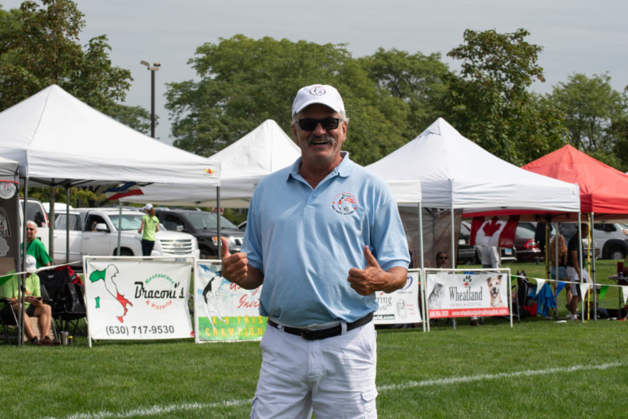 
Alex Stein, creator of the sport frisbee dog, poses in front of the competitors tents. 