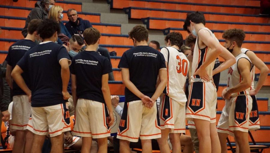 Huskie boys basketball loses tournament game against Hinsdale Central