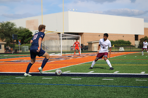 Senior Caden Hill attempts to outmaneuver a Morton player