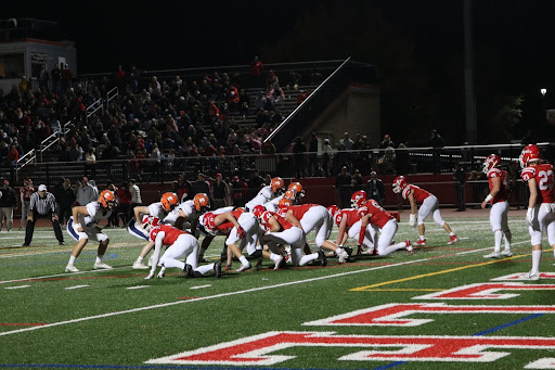 Huskie football defeats crosstown rival Naperville Central