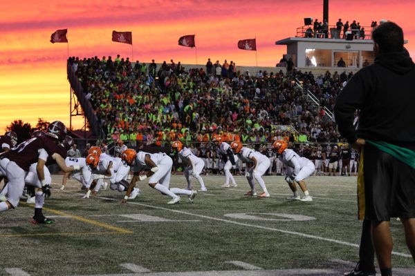 The Huskie defense prepares to make a crucial stop against the Lockport offense.