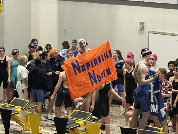 Sophomore swimmer Jules Swatland stood on the block to accept her fourth place finish in the 100 yard breaststroke at sectionals.