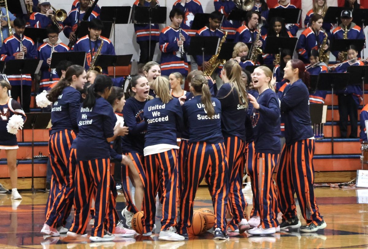 The Huskies excitedly rally around one another before the game.