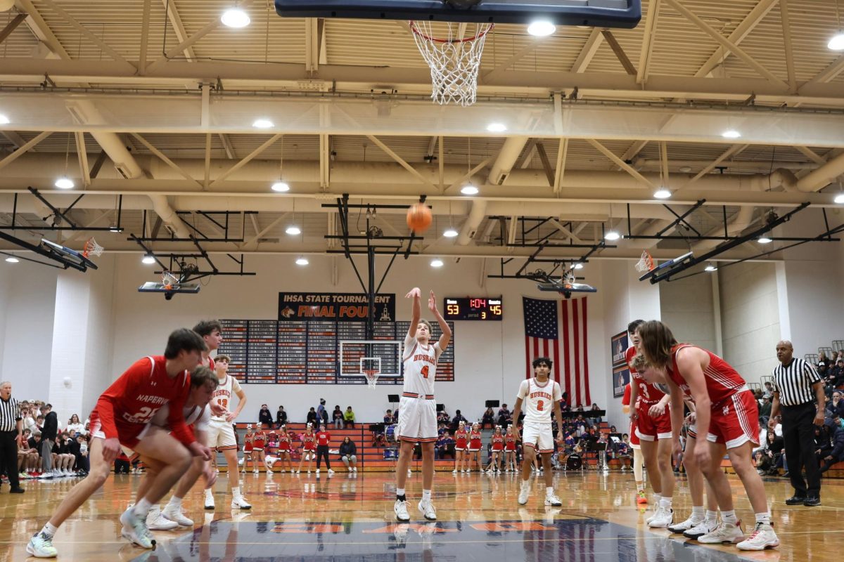 Miles Okyne (4) takes a free throw.