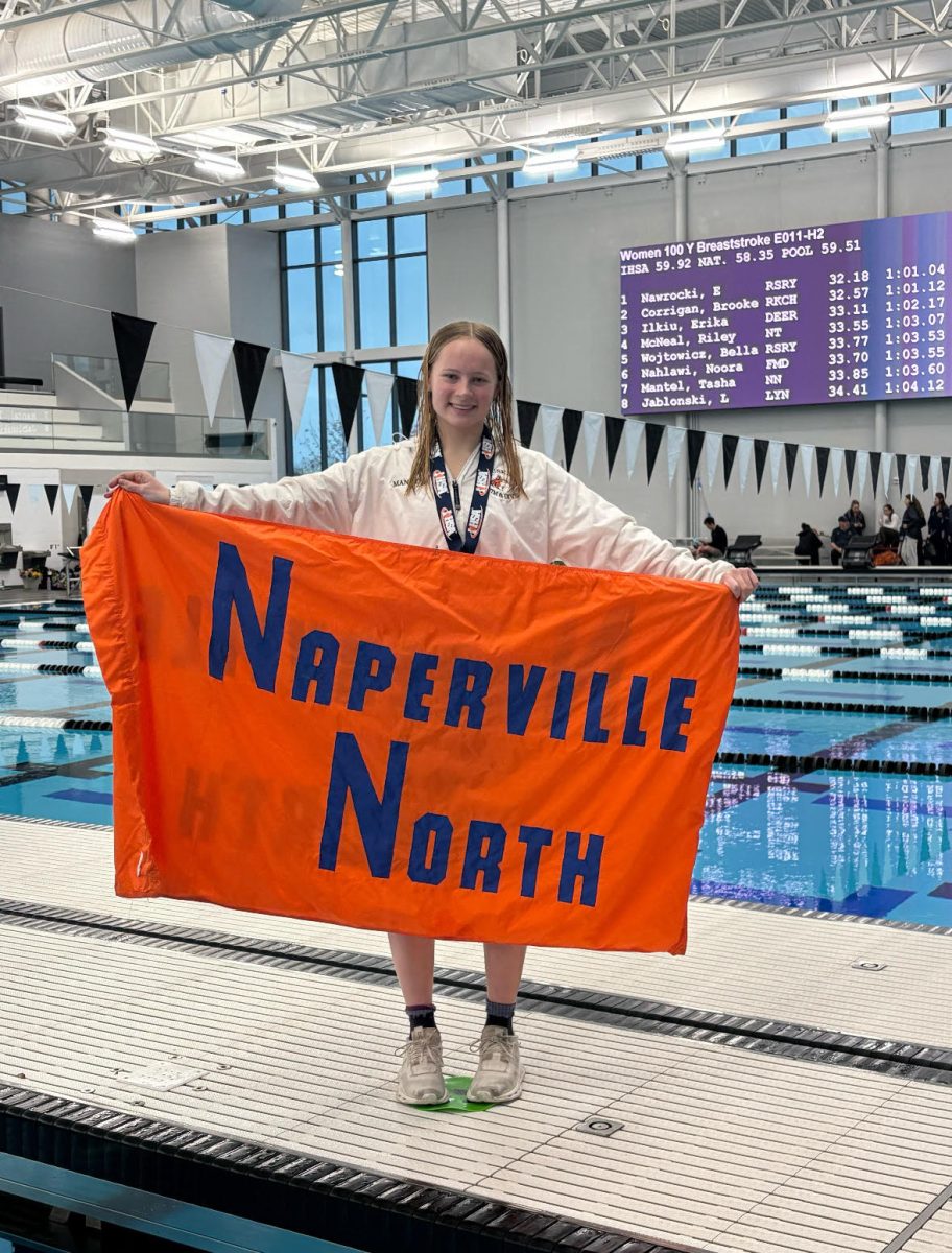 Tasha Mantel poses with a Naperville North flag. Photo courtesy of Tasha Mantel.