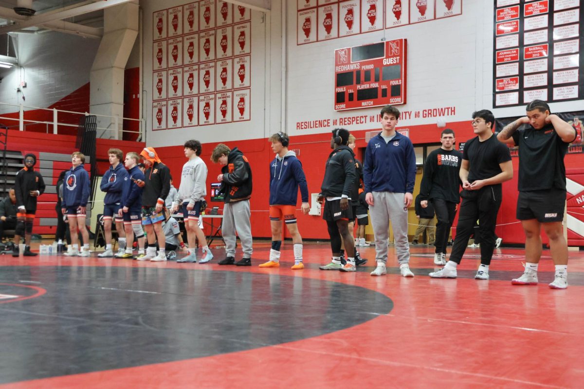 Wrestlers line up for their final match pairings.