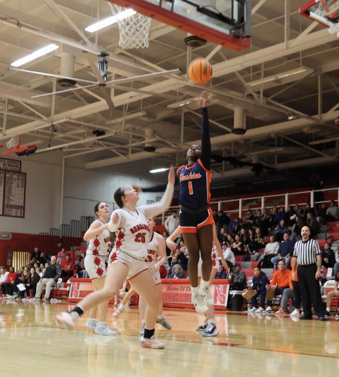 Natalie Frempong (1) shoots a lay-up.