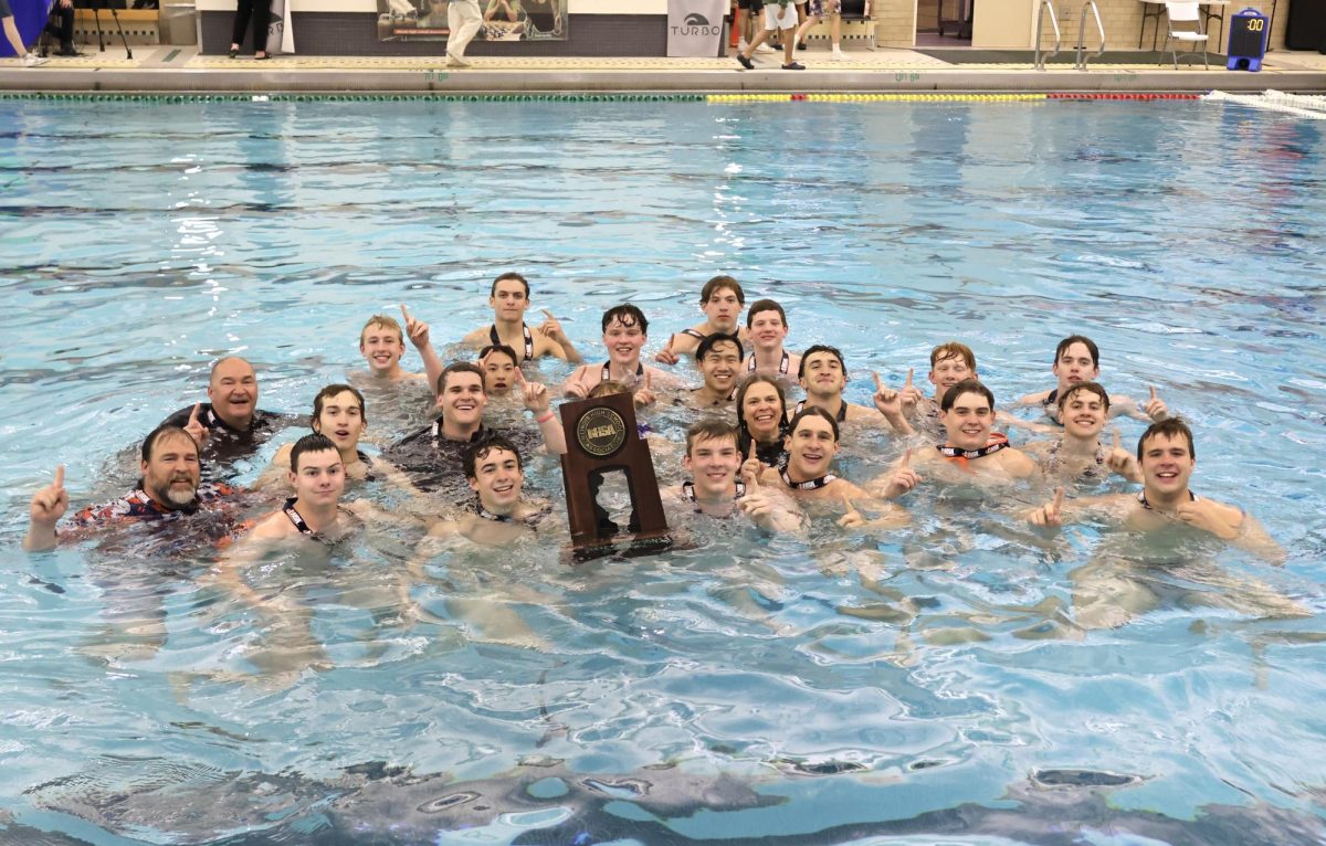 The boys and their coaches hold up "1s" with their state championship trophy.