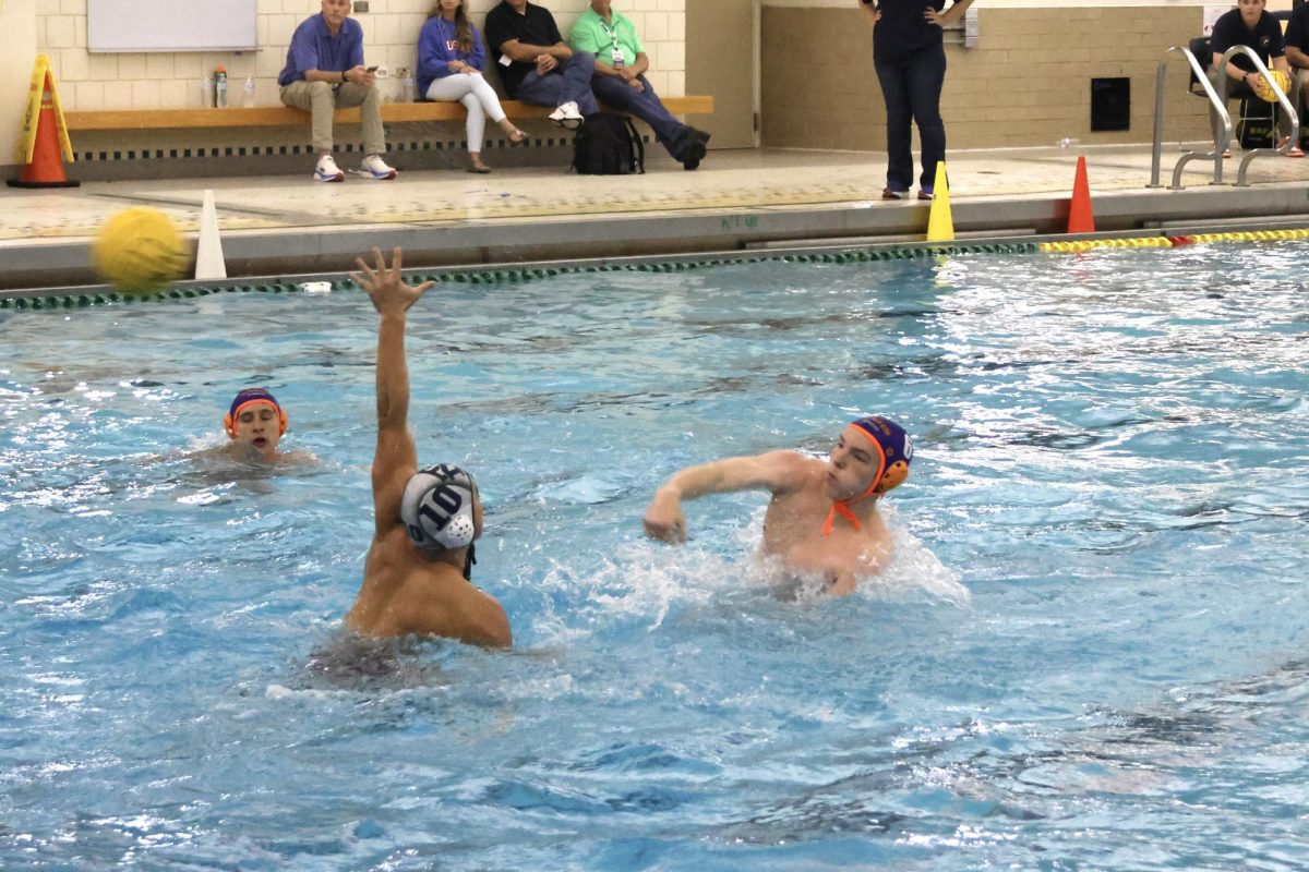 Mason Hofmann (6) shoots over New Trier's Ethan Kim (10) to tie up the game.
