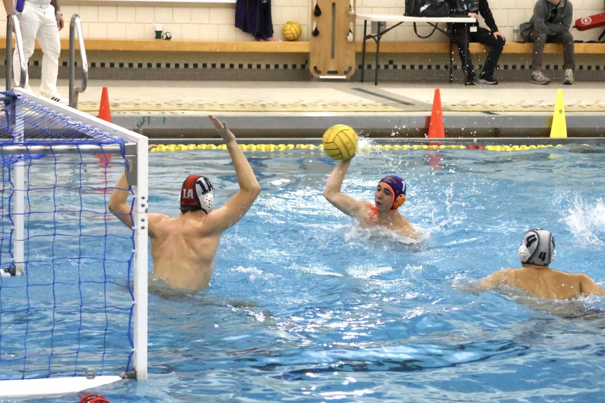 Caden Tsao (11) shoots the final goal of the game to bring the Huskie team into the lead.
