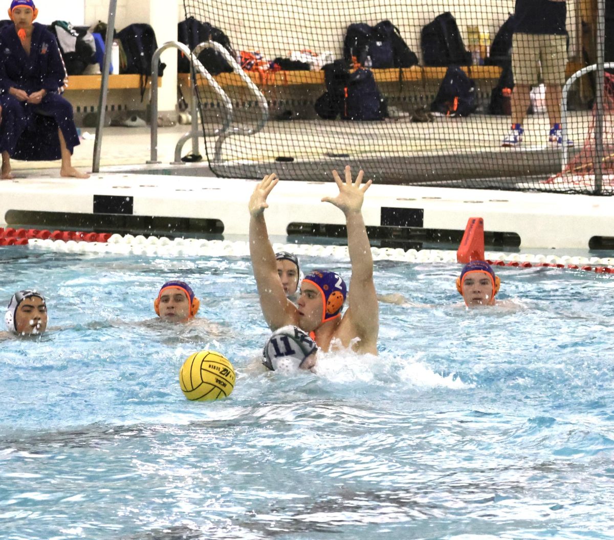 Jack Reif (2) throws up his hands to avoid a foul call.