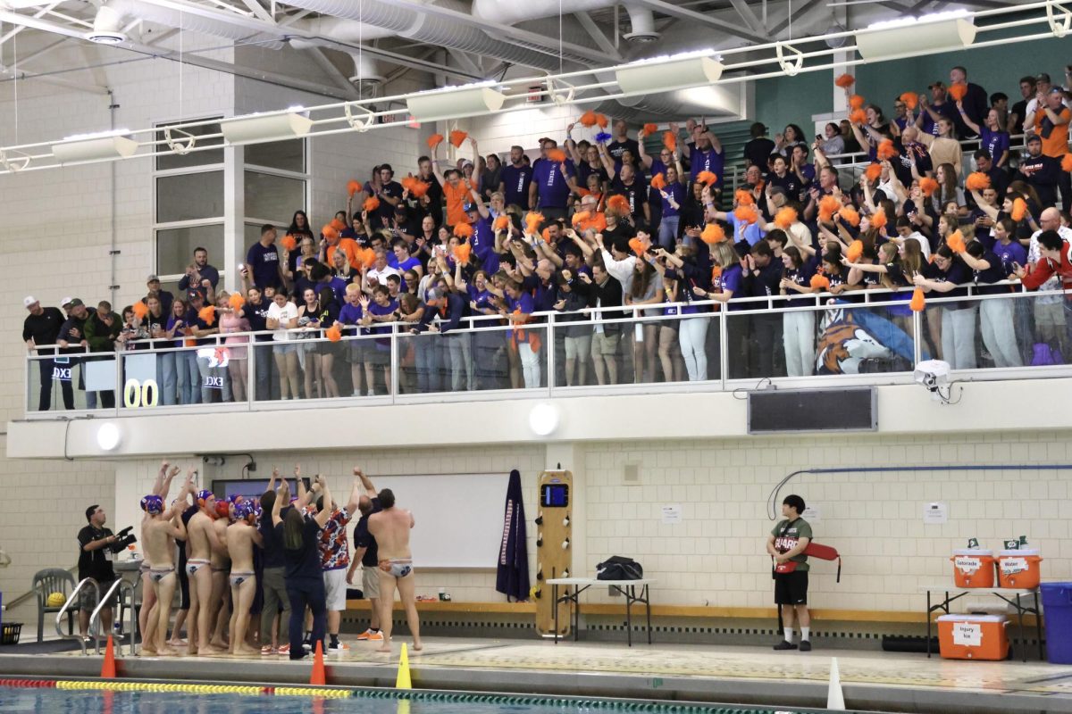 The fans and Huskie team celebrate the state win.