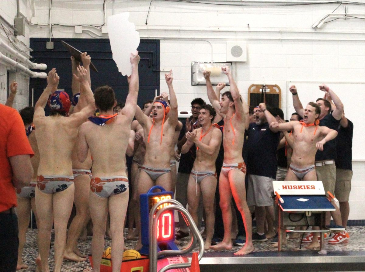 The Huskies celebrate their sectional win.