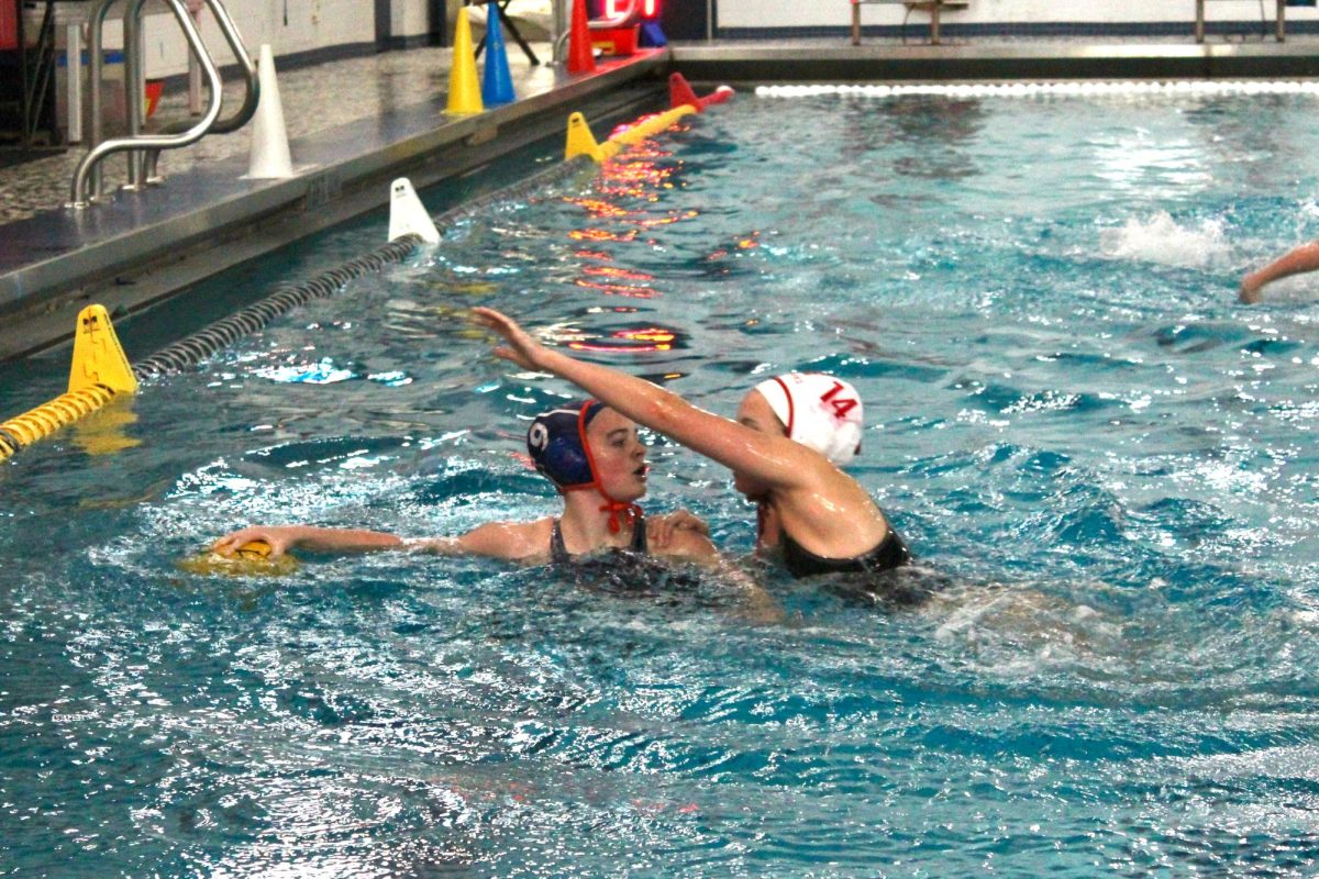Natalie Brown (9) looks for a pass as she keeps herself up.
