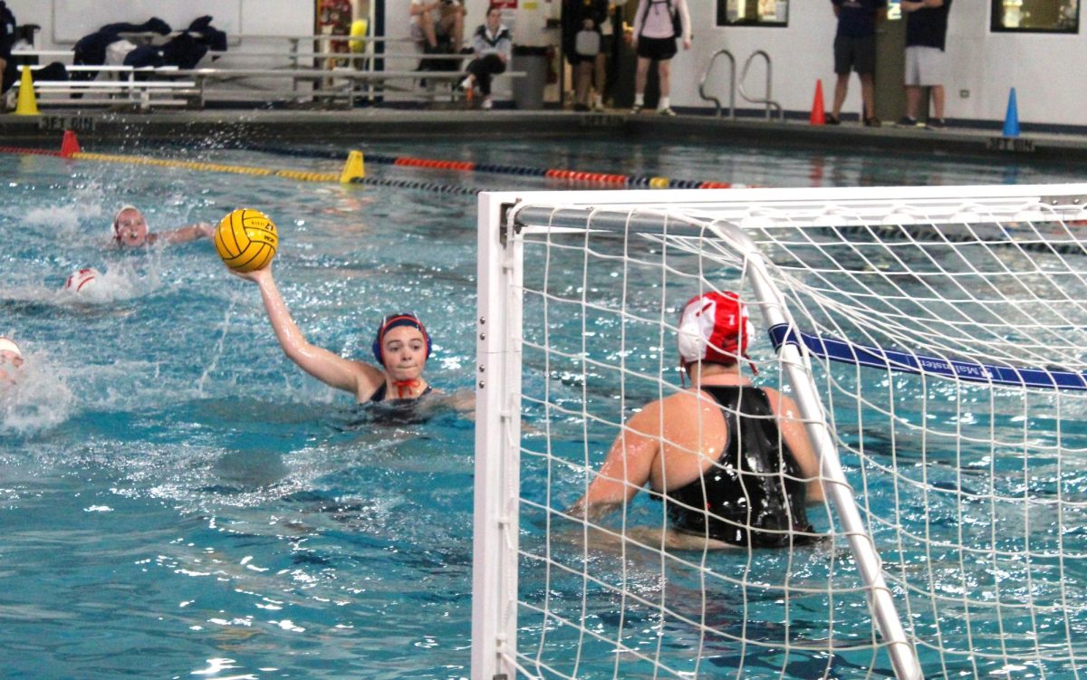 Natalie Brown (9) works the goalie on a one-on-one play.
