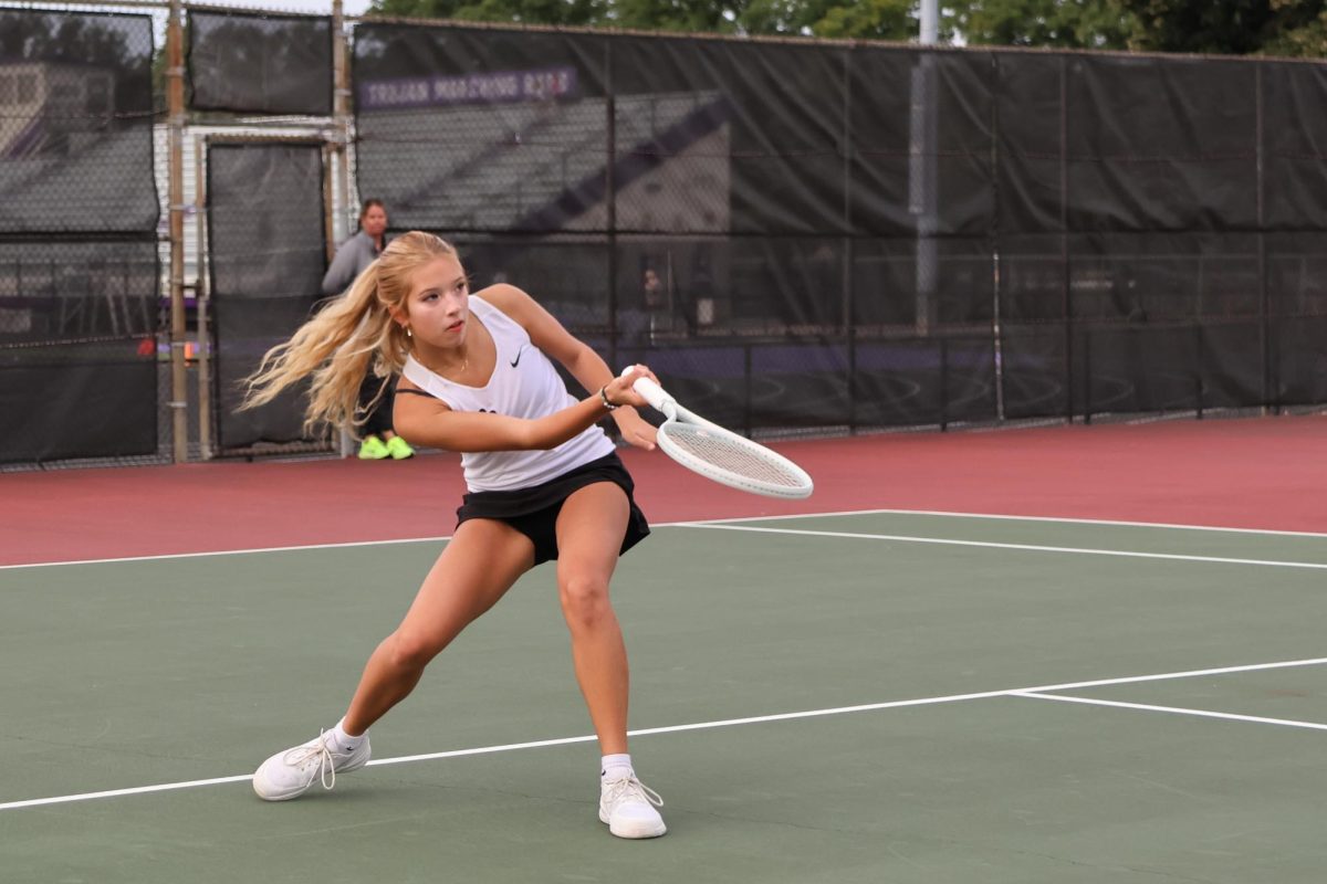 Zannah Chien masterfully hits a low forehand shot.