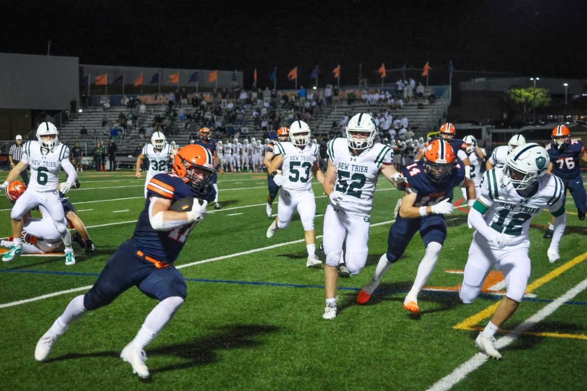 Senior Running Back William Eloe (17) avoids the defense and sets up a touchdown.