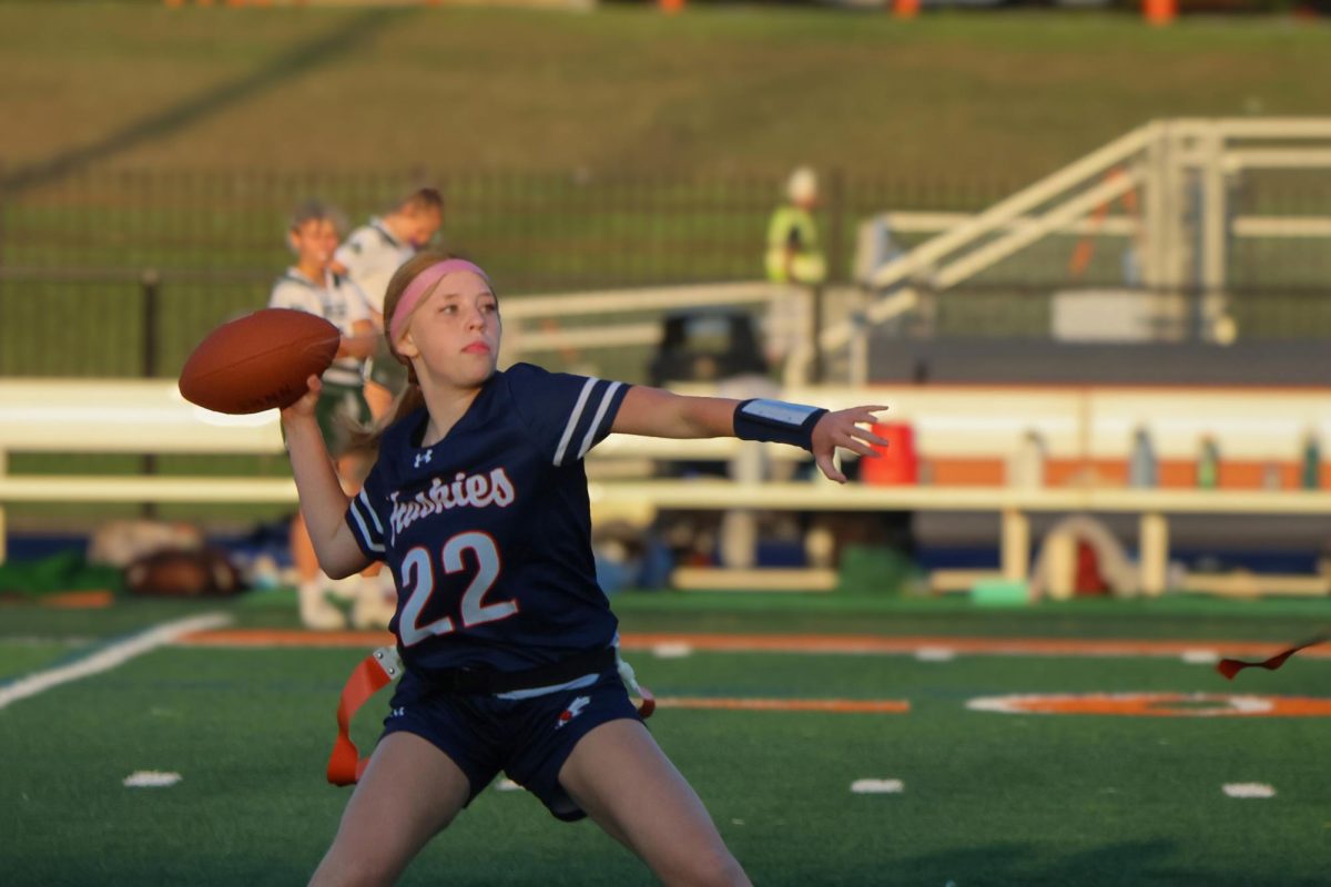 Kendall Louthain (22) throws the ball downfield.