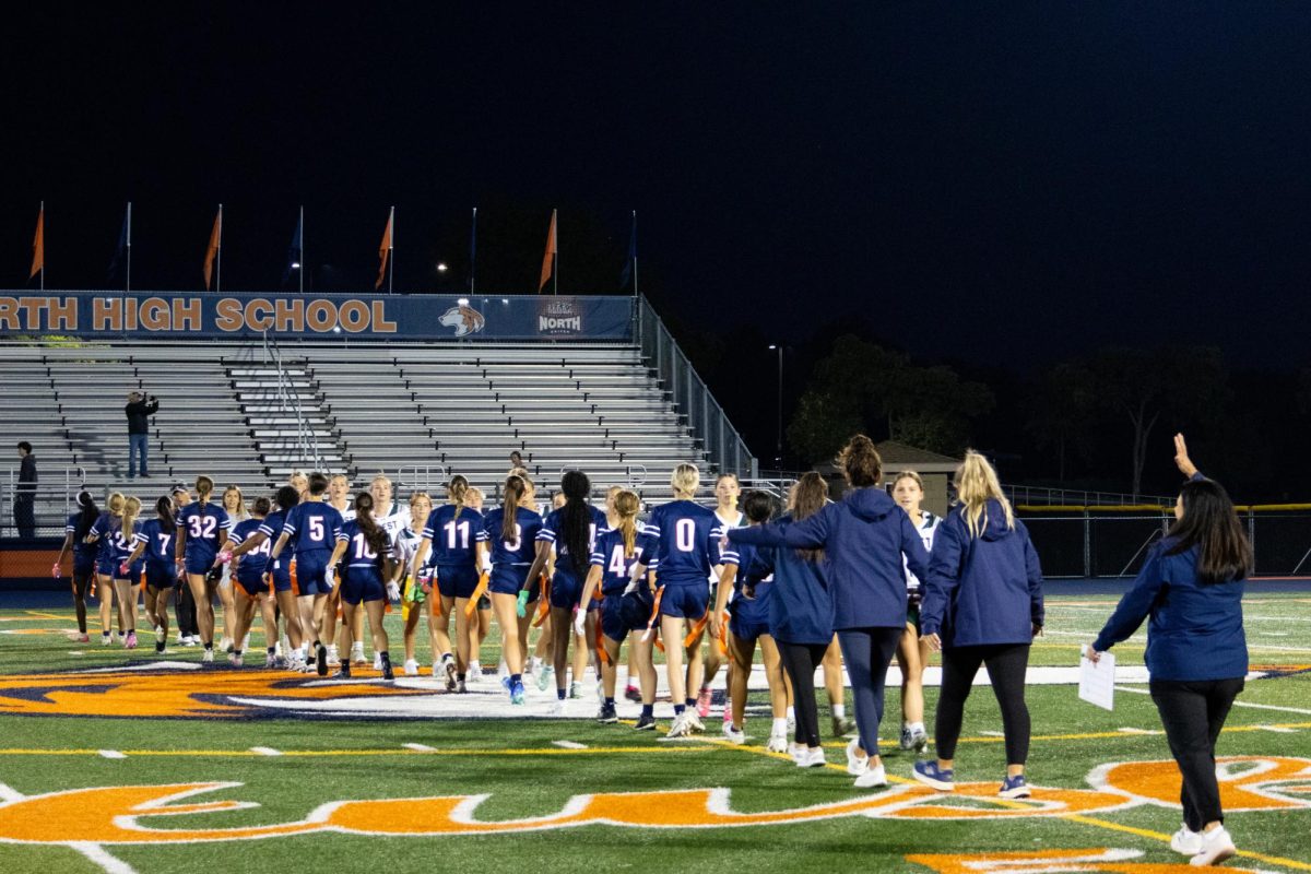Both teams line up for handshakes and high-fives after a close game.