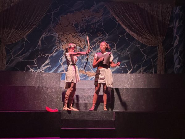 Athena (Ruby Freeman) Coaxes Pandaros (Everleigh Irwin) into inciting a war.