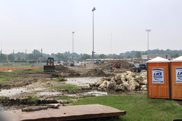 The ripped up and rain-covered field behind North (July 31, 2025).