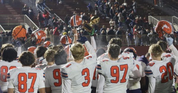 Huskies celebrate win in Crosstown Classic against Naperville Central