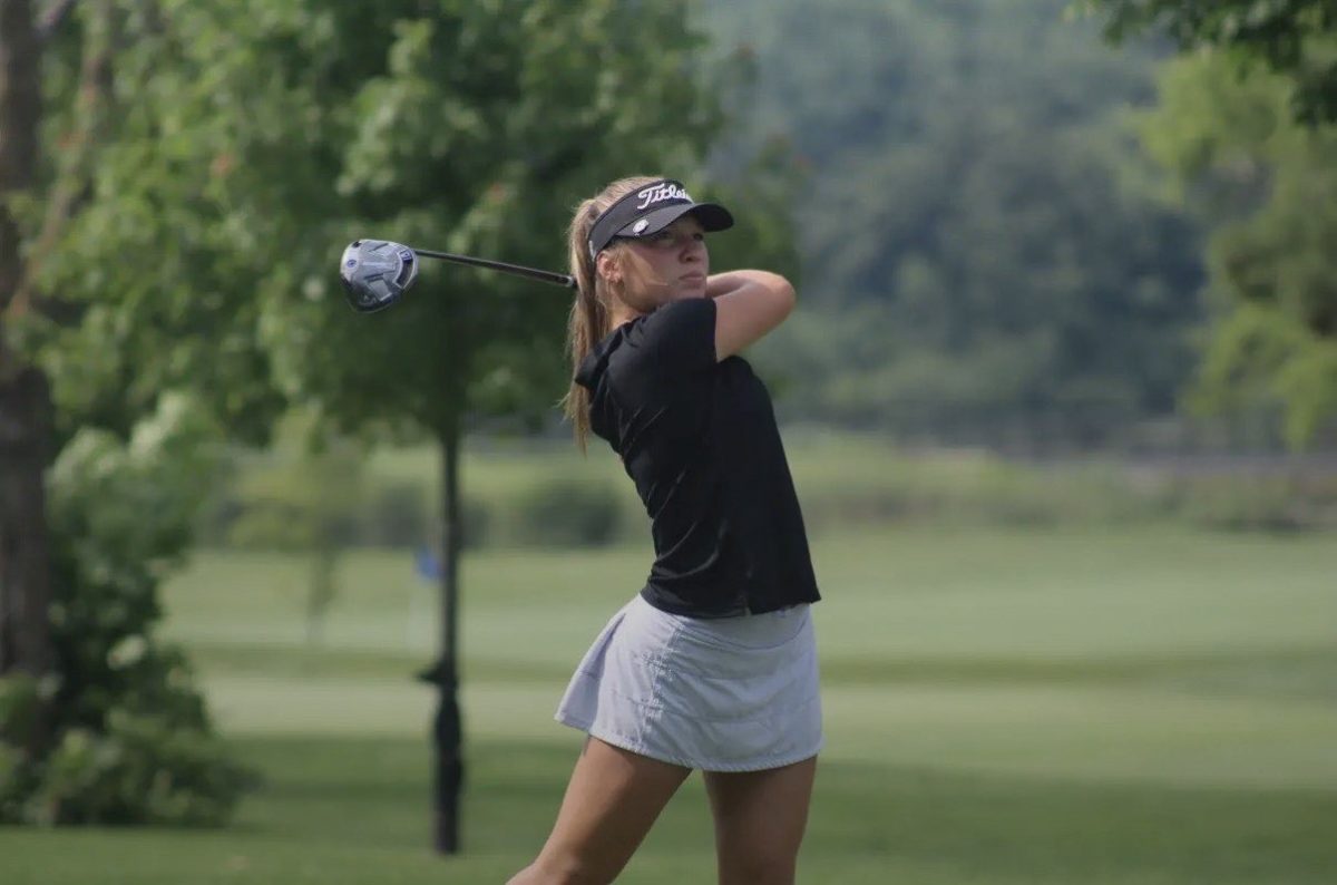 Addyson Ciganek takes a swing during her golf season. Photo courtesy of Illinois Junior Golf Association.