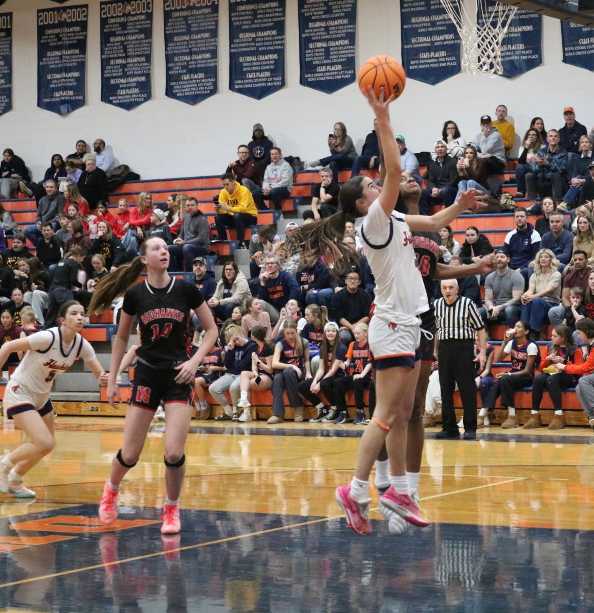 Junior Shooting Guard Ava Podkasik (4) goes a layup.