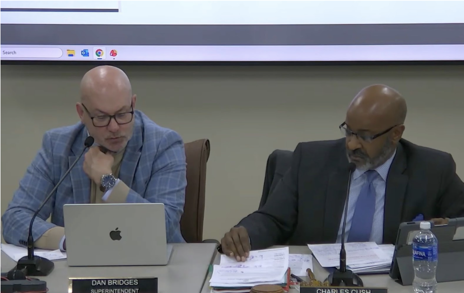 Dan Bridges (left) and Charles Cush (right) at the board meeting on Monday, March 16th. Photo from the Naperville Board of Education YouTube Page.

