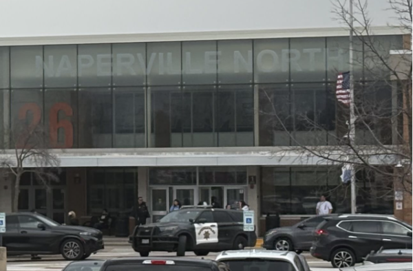 Police car parked outside Naperville North as students are dismissed from the lockdown.
